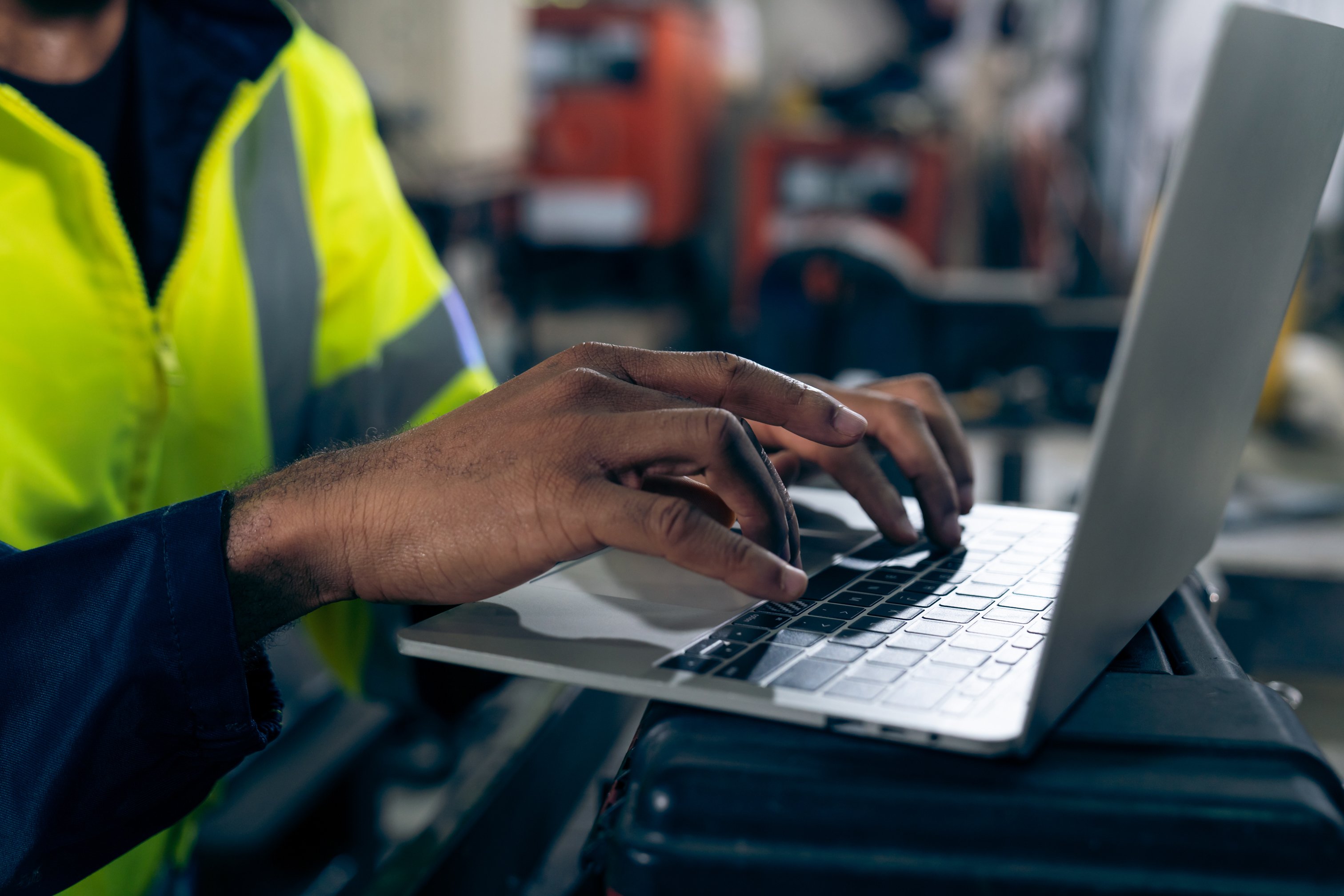factory-worker-working-with-laptop-computer-adept-procedure-checklist