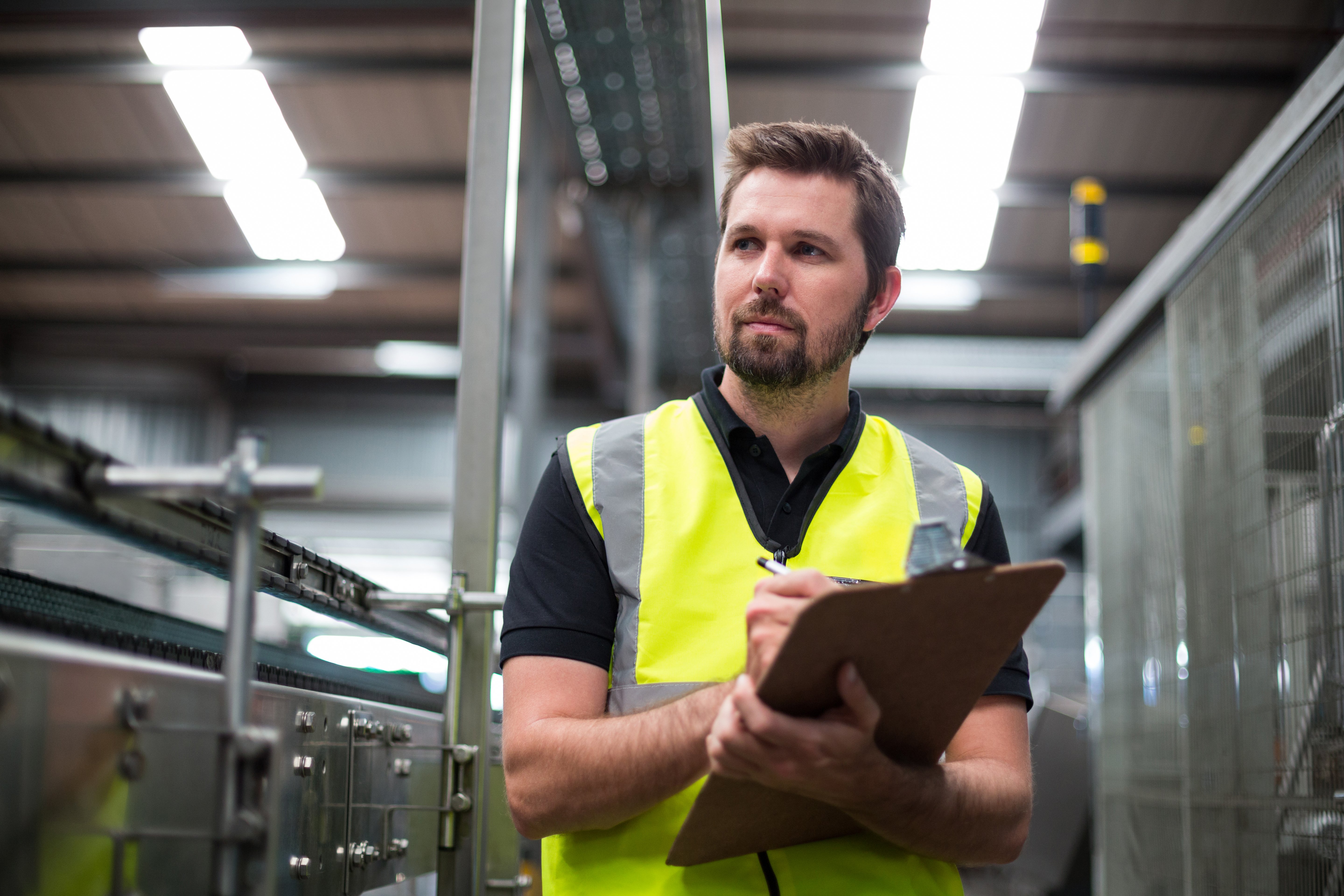 factory-worker-writing-clipboard-factory