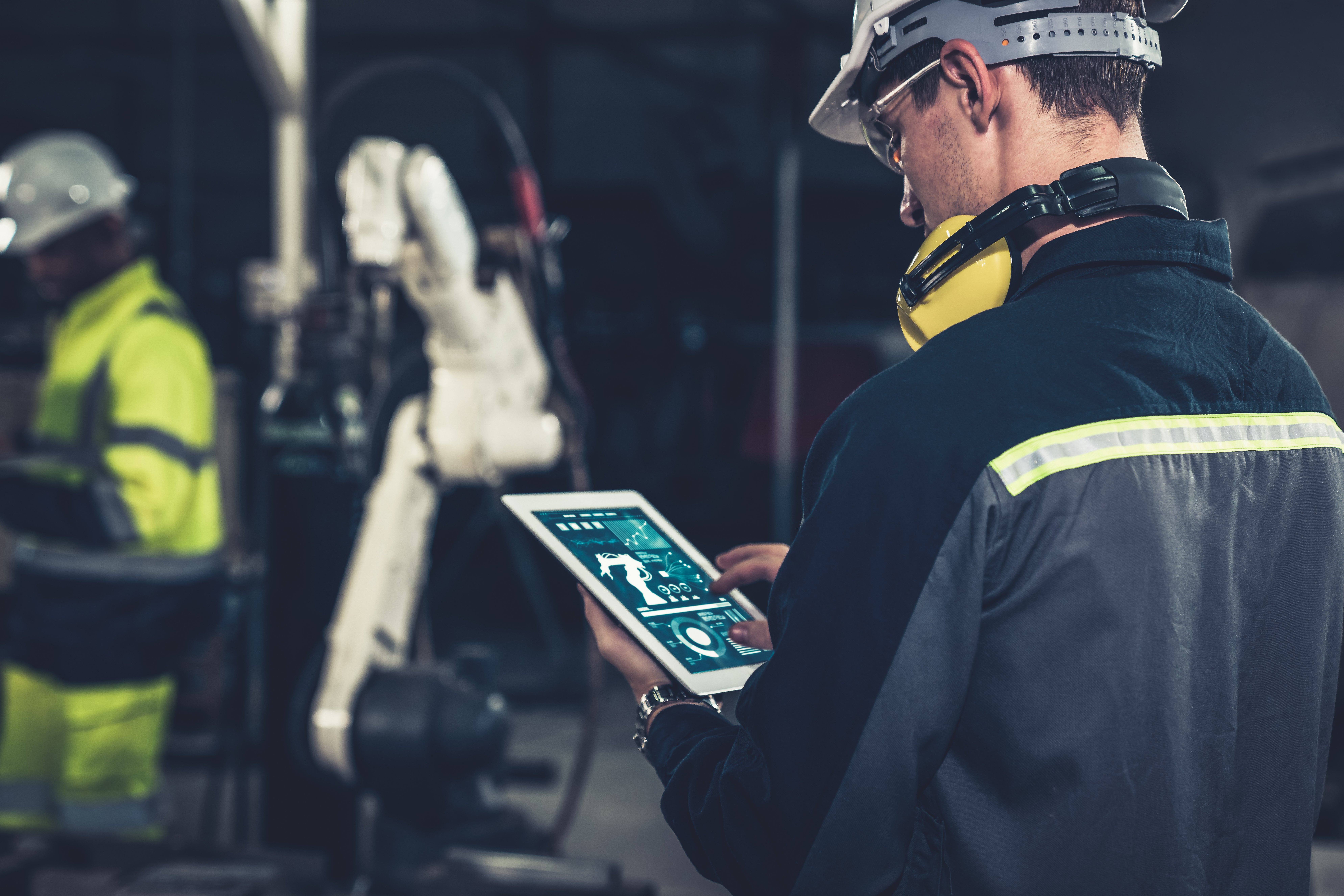 factory-workers-working-with-adept-robotic-arm-workshop