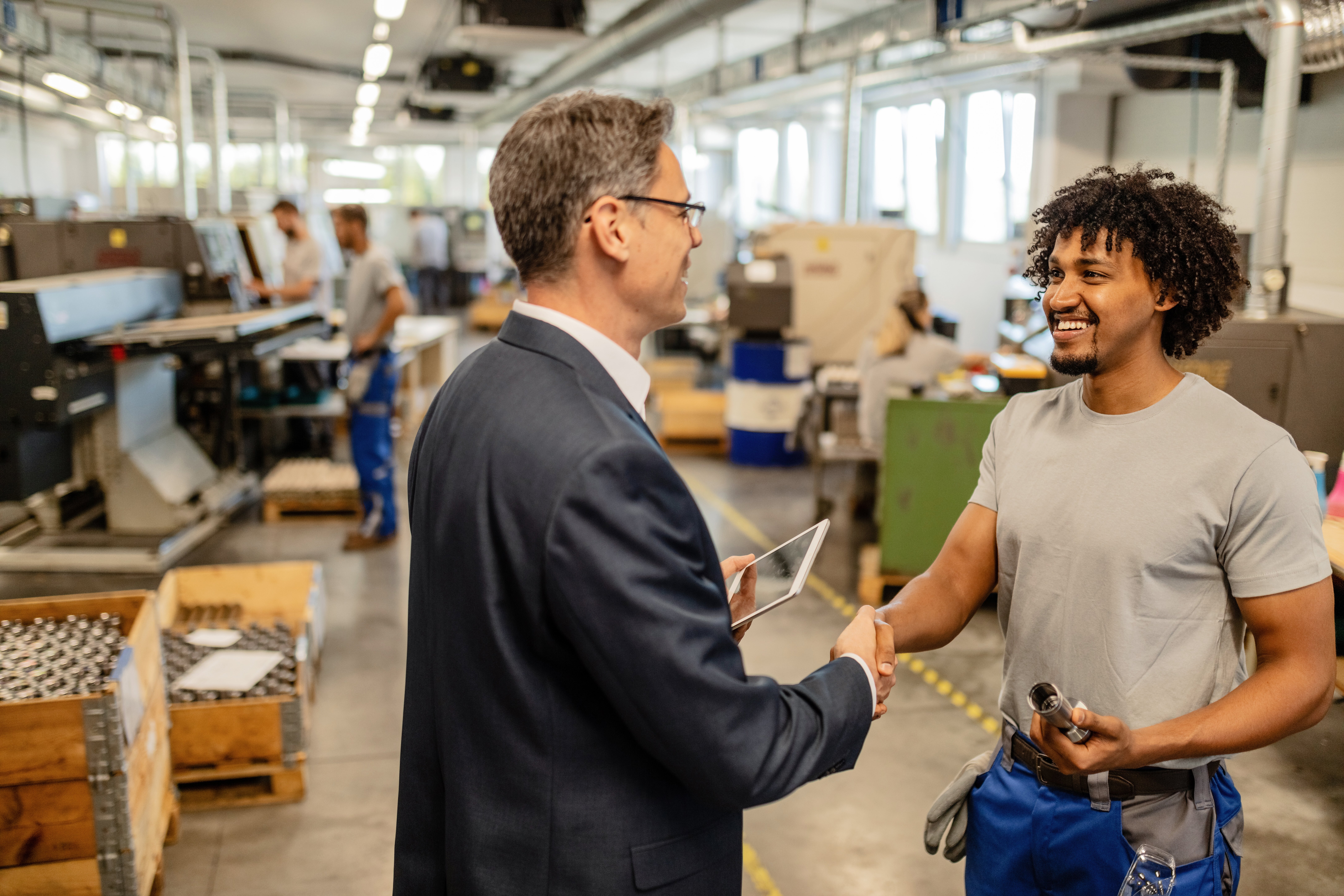 happy-manual-worker-shaking-hands-with-company-engineer-factory-plant