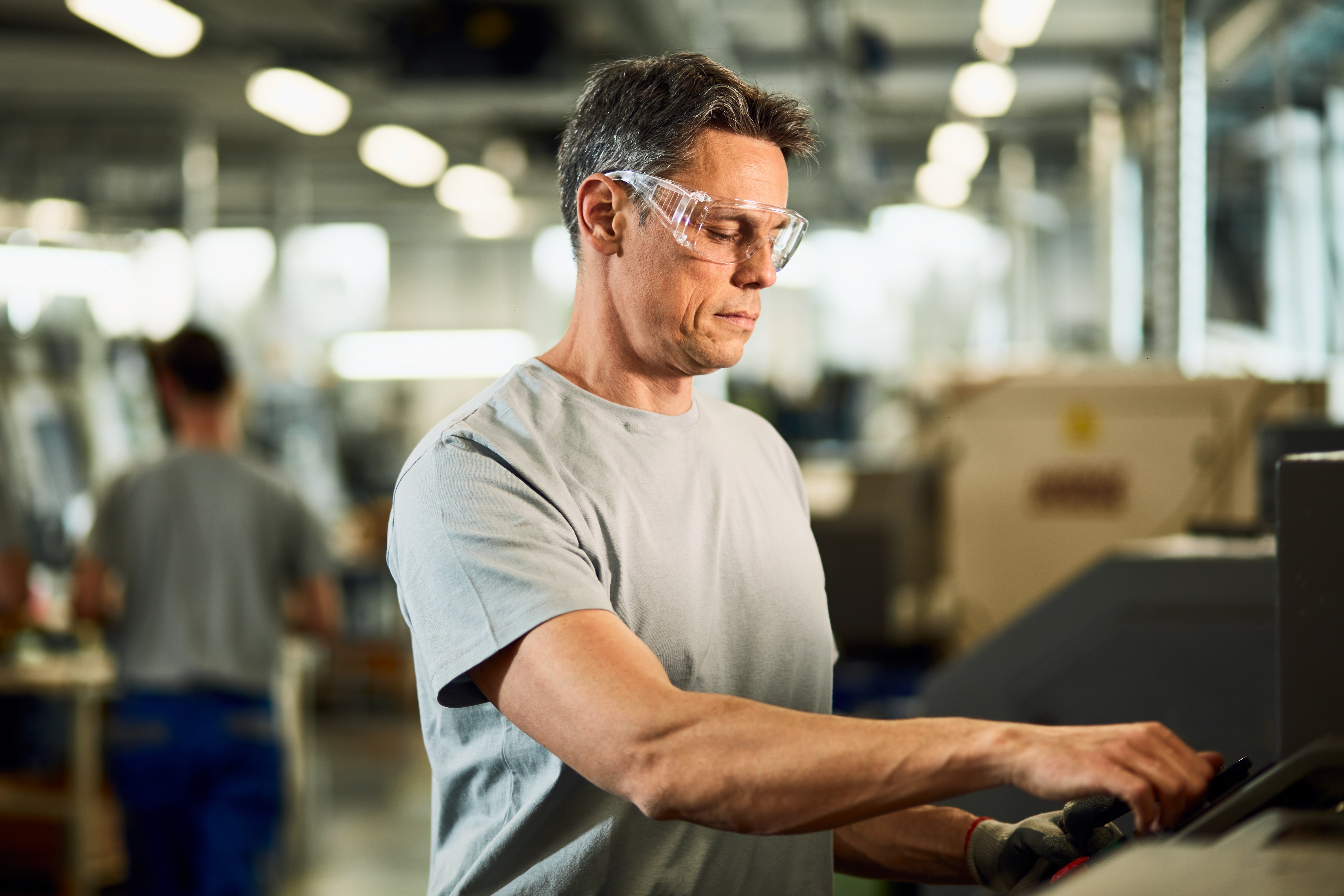industrial-engineer-operating-cnc-machine-production-line