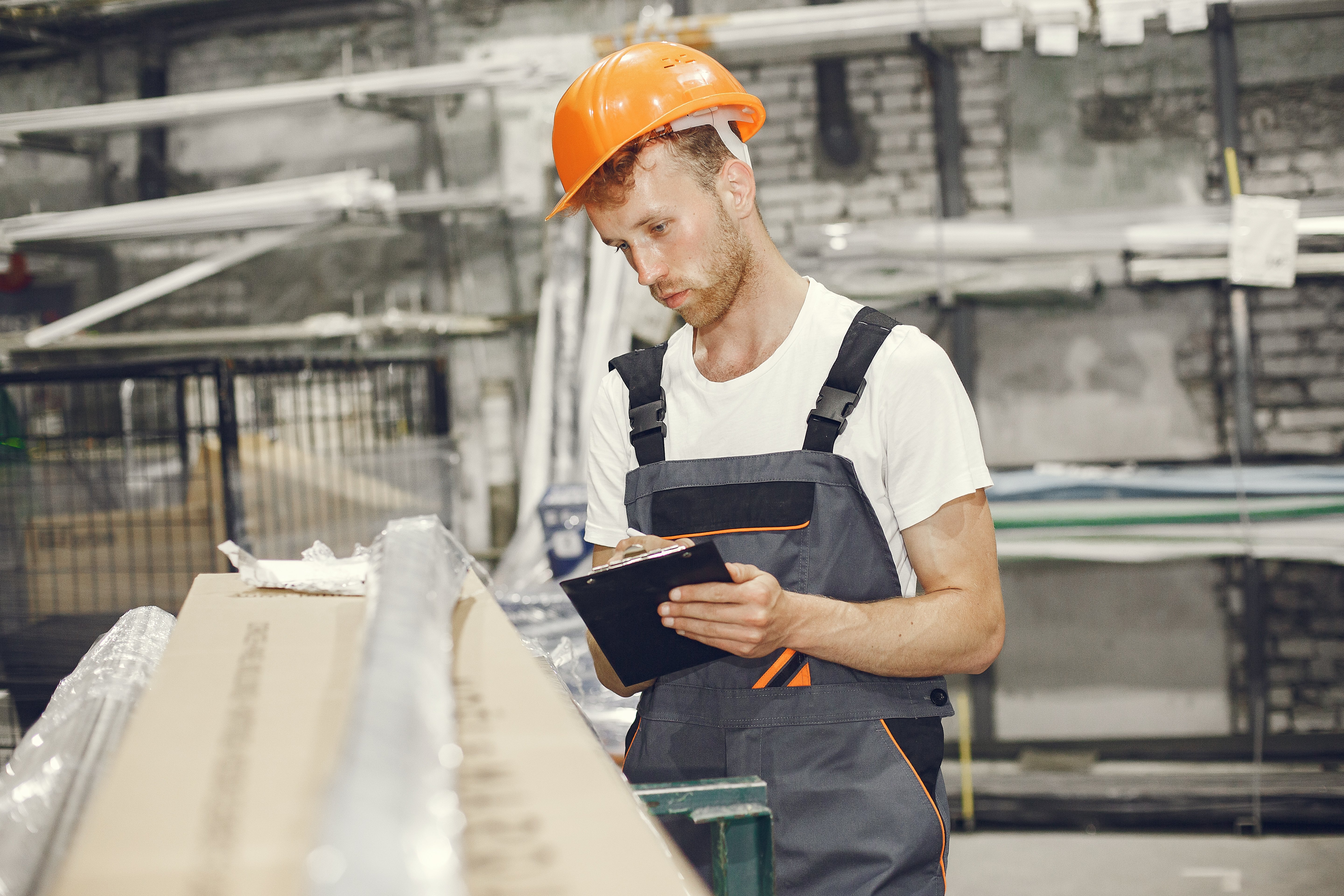 industrial-worker-indoors-factory-young-technician-with-orange-hard-hat