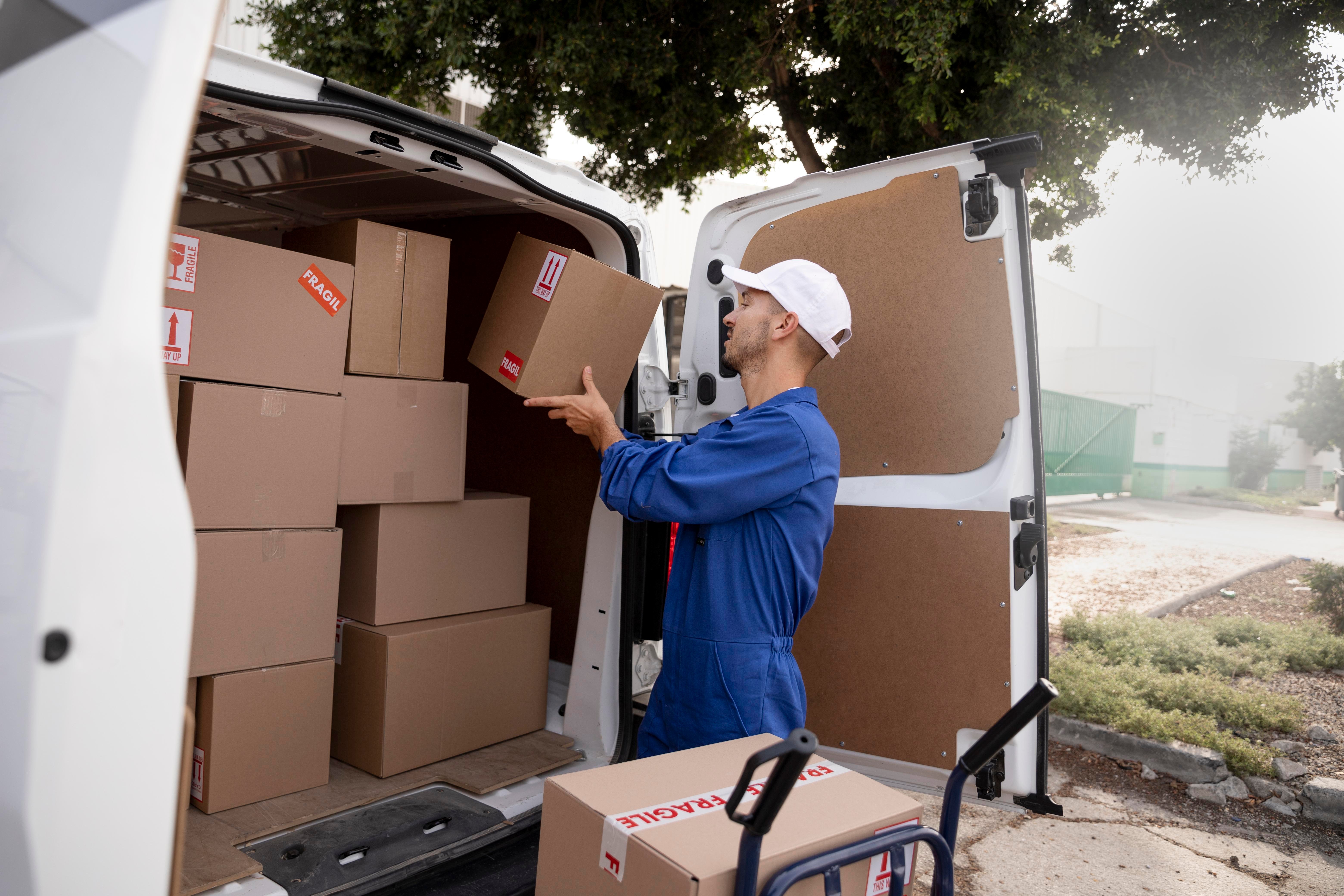 medium-shot-delivery-man-holding-pack