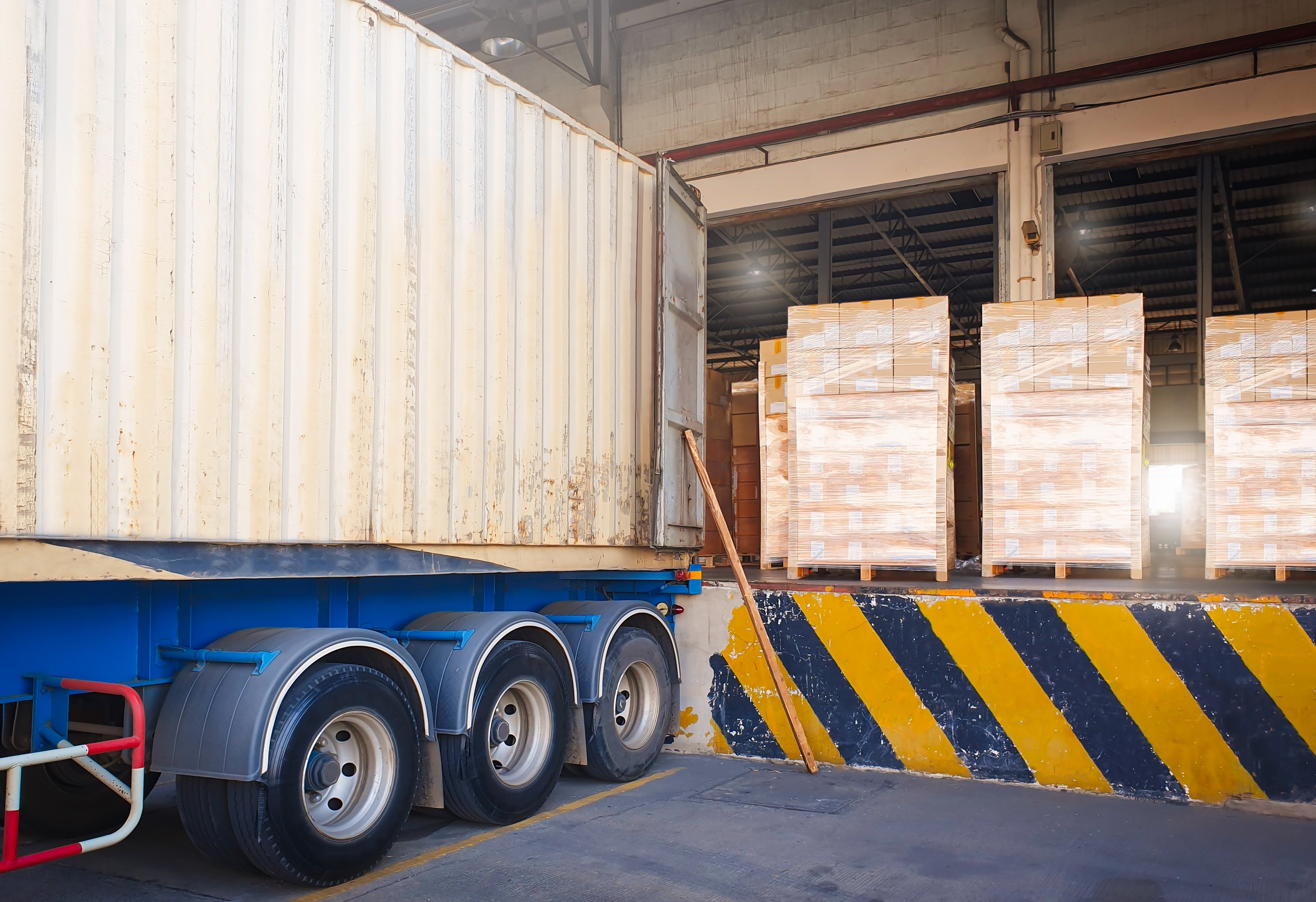 package-boxes-wrapped-plastic-loading-with-cargo-container-truck-loading-dock-warehouse-shipping