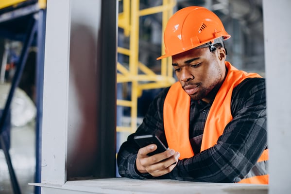 portrait-african-american-man-talking-phone-factory