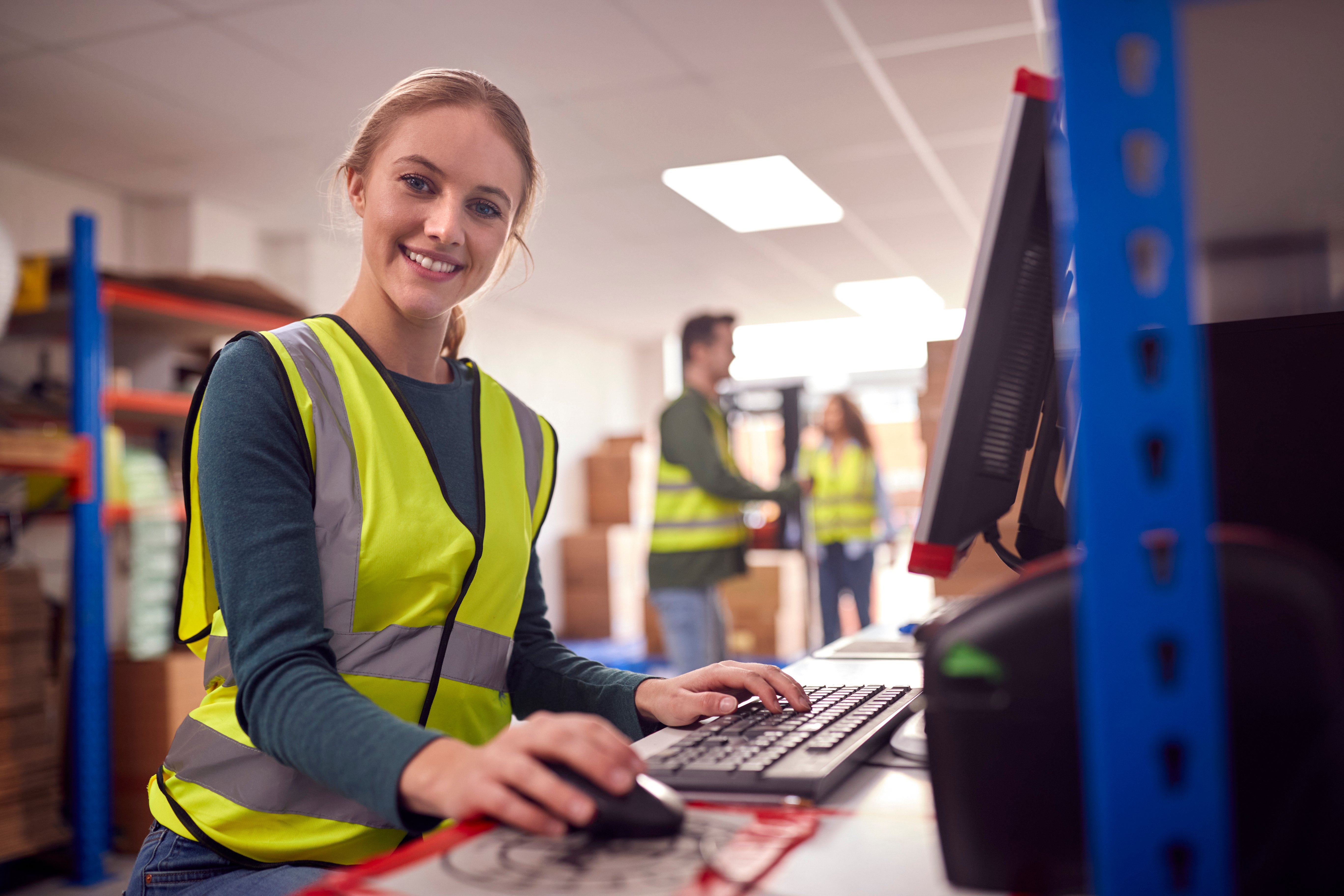 portrait-female-worker-busy-modern-warehouse-working-computer-terminal