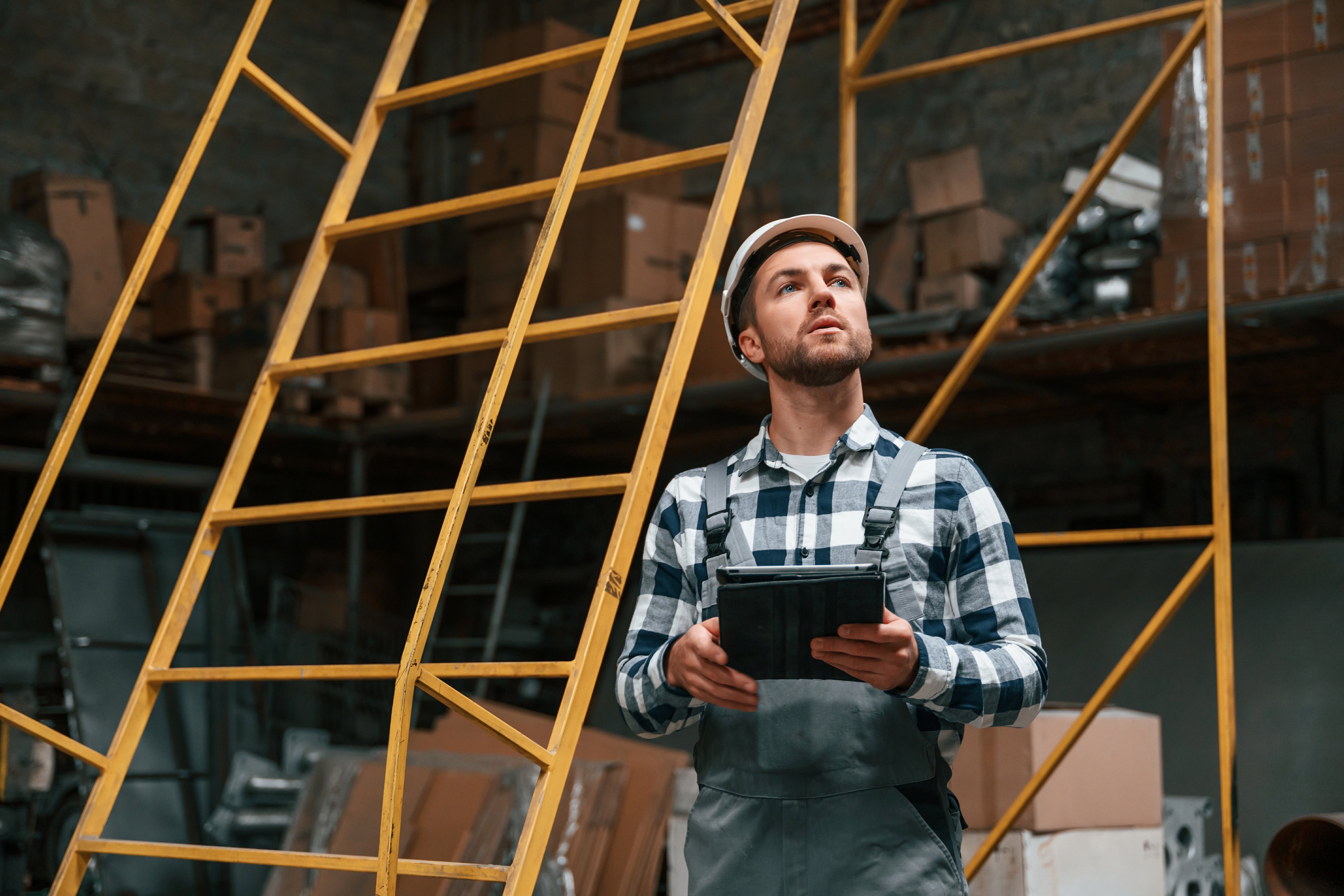 serious-factory-male-worker-uniform-is-indoors