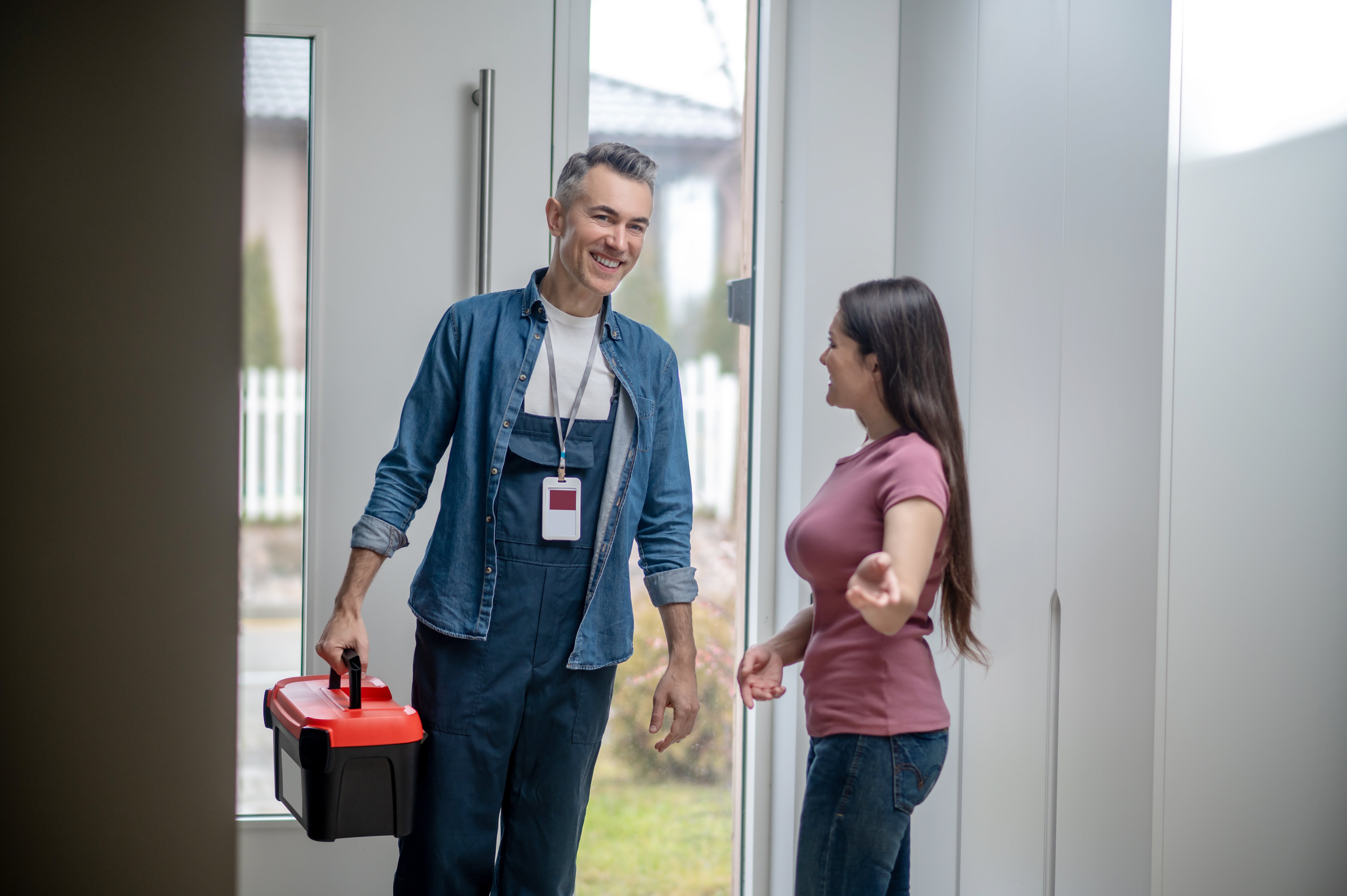 woman-inviting-man-house-with-tools